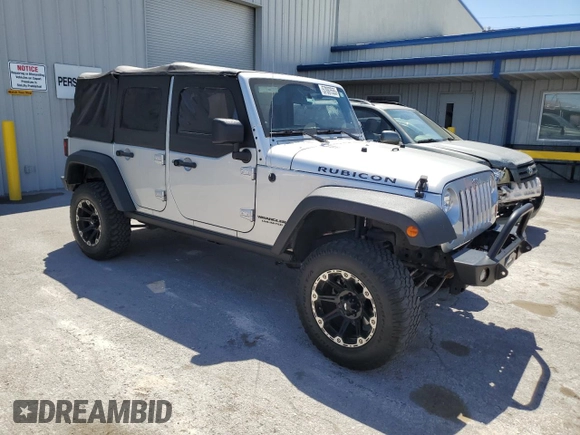 2012 Jeep Wrangler Unlimited Call of Duty MW3 with VIN 1C4BJWFG9CL199551, listed as a Copart auction lot 57097555 with 43,651 mi miles and Salvage title. Bid and sale history available at DreamBid. Image 4.