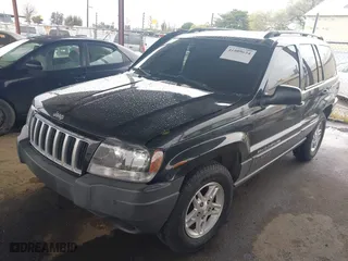 2004 Jeep Grand Cherokee Laredo with VIN 1J4GX48N94C435700, listed as a IAAI auction lot 41809624 with 147,413 mi miles. Bid and sale history available at carsss.com. Image 17.