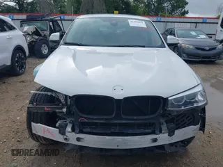 2015 BMW X4 xDrive28i with VIN 5UXXW3C51F0M86668, listed as a IAAI auction lot 42489071 with 59,694 mi miles and . Bid and sale history available at DreamBid. Image 13.