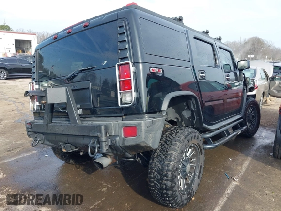 2006 Hummer H2 with VIN 5GRGN23U06H113353, listed as a IAAI auction lot 41476649 with 165,370 mi miles. Bid and sale history available at carsss.com. Image 4.