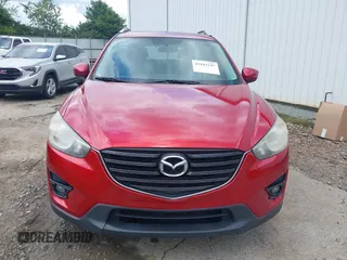 2016 Mazda CX-5 Grand Touring z VIN JM3KE2DY6G0693678, wystawiony jako IAAI lot #42443247 z przebiegiem 127 620 mil mil oraz . Historia ofert i sprzedaży dostępna na DreamBid. Obrazek 12.