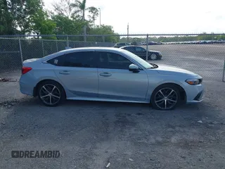 2023 Honda Civic Touring with VIN 2HGFE1F91PH305053, listed as a IAAI auction lot 42378311 with 41,576 mi miles and . Bid and sale history available at DreamBid. Image 14.