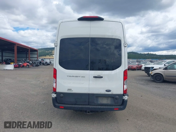 2020 Ford Transit Cargo with VIN 1FTBW3UGXLKA14030, listed as a IAAI auction lot 42505110 with 169,612 mi miles and . Bid and sale history available at DreamBid. Image 16.