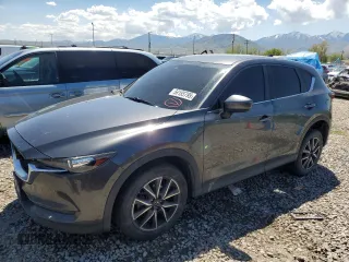 2018 Mazda CX-5 Touring z VIN JM3KFACM5J0338126, wystawiony jako Copart lot #56185795 z przebiegiem 115 254 mil mil oraz Szkoda całkowita • Salvage title. Historia ofert i sprzedaży dostępna na DreamBid. Obrazek 1.
