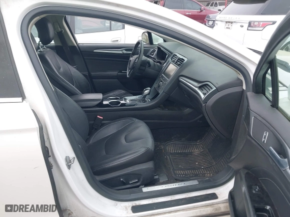 2014 Ford Fusion Titanium Hybrid with VIN 3FA6P0RU6ER115985, listed as a IAAI auction lot 41870494 with 132,321 mi miles. Bid and sale history available at carsss.com. Image 5.