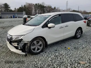2019 Honda Odyssey EX-L with VIN 5FNRL6H72KB014960, listed as a Copart auction lot 48701035 with 131,921 mi miles and Salvage Title. Bid and sale history available at carsss.com. Image 1.