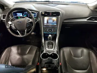 2014 Ford Fusion Titanium Hybrid z VIN 3FA6P0RUXER168706, wystawiony jako Copart lot #55362295 z przebiegiem 136 382 mil mil oraz Czysty tytuł • Clean title. Historia ofert i sprzedaży dostępna na DreamBid. Obrazek 8.
