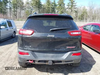 2014 Jeep Cherokee Trailhawk with VIN 1C4PJMBS3EW127749, listed as a IAAI auction lot 41836617 with 207,002 mi miles and . Bid and sale history available at DreamBid. Image 16.