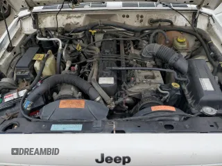 1997 Jeep Cherokee Country with VIN 1J4FJ78S9VL576899, listed as a Copart auction lot 82303584 with 335,746 mi miles and Salvage Title. Bid and sale history available at carsss.com. Image 14.