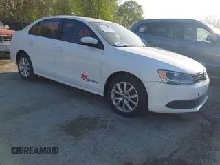2012 Volkswagen Jetta Sedan SE w/Convenience & Sunroof with VIN 3VWDX7AJ4CM386885, listed as a IAAI auction lot 42052411 with 328,232 mi miles. Bid and sale history available at carsss.com. Image 1.