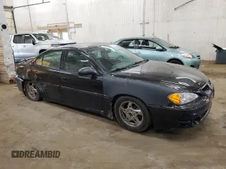2003 Pontiac Grand Am GT with VIN 1G2NW52EX3M579719, listed as a Copart auction lot 49891365 with 153,838 mi miles and Salvage Title. Bid and sale history available at carsss.com. Image 4.