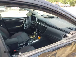 2018 Toyota Corolla L with VIN 2T1BURHE1JC052651, listed as a IAAI auction lot 42430958 with 104,664 mi miles and . Bid and sale history available at DreamBid. Image 5.
