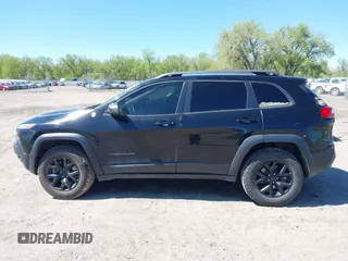 2018 Jeep Cherokee Trailhawk Leather Plus with VIN 1C4PJMBXXJD572667, listed as a IAAI auction lot 42216477 with 85,890 mi miles and . Bid and sale history available at DreamBid. Image 14.