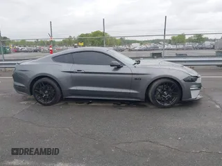 2021 Ford Mustang GT z VIN 1FA6P8CF0M5105060, wystawiony jako IAAI lot #41967671 z przebiegiem 27 626 mil mil oraz . Historia ofert i sprzedaży dostępna na DreamBid. Obrazek 13.