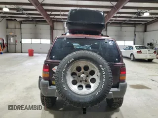 1996 Jeep Grand Cherokee Laredo with VIN 1J4GZ58Y1TC171915, listed as a Copart auction lot 50764034 with 0 mi miles and Salvage Title. Bid and sale history available at carsss.com. Image 6.
