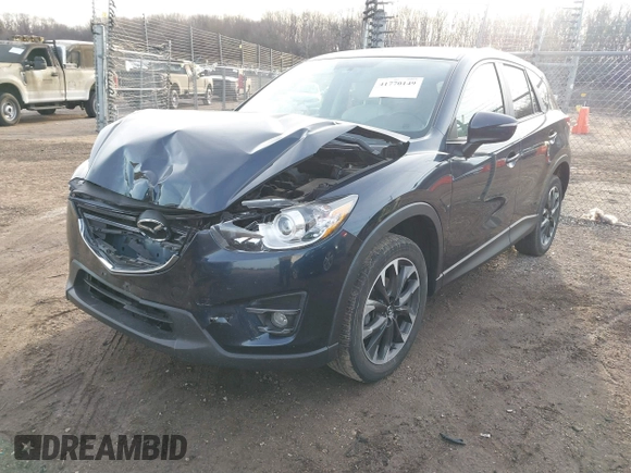 2016 Mazda CX-5 Grand Touring with VIN JM3KE4DY1G0823989, listed as a IAAI auction lot 41770149 with 40,677 mi miles. Bid and sale history available at carsss.com. Image 17.