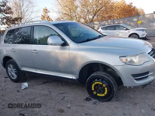 2008 Volkswagen Touareg V6 with VIN WVGBE77LX8D027323, listed as a IAAI auction lot 41240460 with 140,330 mi miles and . Bid and sale history available at DreamBid. Image 1.