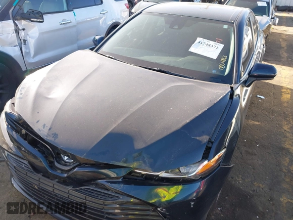 2020 Toyota Camry LE with VIN 4T1C11AK0LU864863, listed as a IAAI auction lot 41748371 with 82,063 mi miles and . Bid and sale history available at carsss.com. Image 6.
