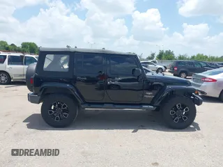 2015 Jeep Wrangler Unlimited Sahara with VIN 1C4HJWEG6FL572674, listed as a IAAI auction lot 42736266 with 97,024 mi miles and . Bid and sale history available at DreamBid. Image 13.