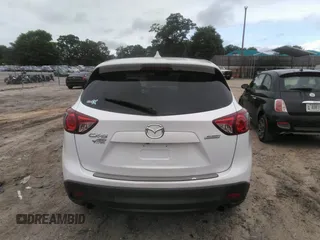 2014 Mazda CX-5 Touring z VIN JM3KE4CY0E0303748, wystawiony jako IAAI lot #42127406 z przebiegiem Nie podano mil oraz . Historia ofert i sprzedaży dostępna na DreamBid. Obrazek 15.