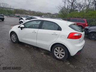 2013 Kia Rio SX with VIN KNADN5A34D6245263, listed as a IAAI auction lot 41976166 with 101,438 mi miles. Bid and sale history available at carsss.com. Image 3.