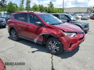 2018 Toyota RAV4 LE with VIN 2T3BFREVXJW838680, listed as a Copart auction lot 61452055 with 79,016 mi miles and Salvage title. Bid and sale history available at DreamBid. Image 4.