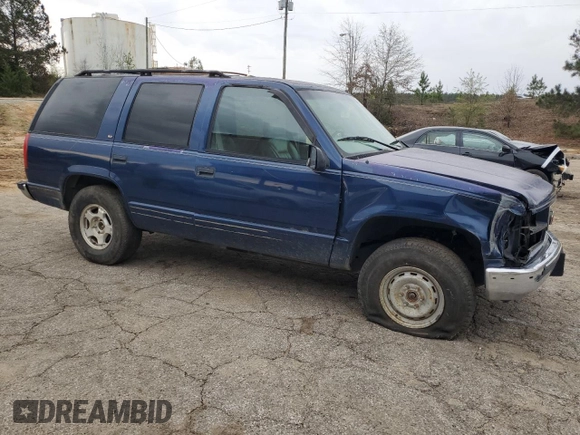 1998 GMC Yukon with VIN 1GKEK13R5WR514208, listed as a Copart auction lot 49724615 with 260,788 mi miles and Salvage Title. Bid and sale history available at carsss.com. Image 4.