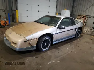 1986 Pontiac Fiero z VIN 1G2PG9791GP270010, wystawiony jako Copart lot #85058834 z przebiegiem 193 802 mil mil oraz Tytuł czysty. Historia ofert i sprzedaży dostępna na DreamBid. Obrazek 1.