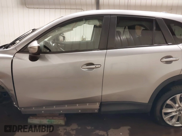 2015 Mazda CX-5 Grand Touring with VIN JM3KE4DY2F0477966, listed as a IAAI auction lot 41247178 with 116,582 mi miles. Bid and sale history available at carsss.com. Image 15.