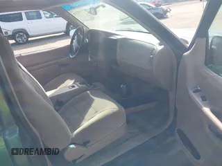 1999 Ford Explorer Sport with VIN 1FMYU22X2XUB19728, listed as a IAAI auction lot 41642358 with 128,788 mi miles and . Bid and sale history available at DreamBid. Image 5.
