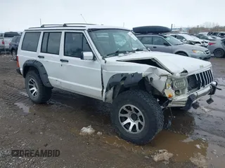 1990 Jeep Cherokee z VIN 1J4FJ78L0LL217723, wystawiony jako IAAI lot #41788403 z przebiegiem 147 557 mil mil oraz . Historia ofert i sprzedaży dostępna na DreamBid. Obrazek 1.