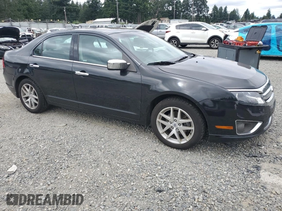 2012 Ford Fusion SEL z VIN 3FAHP0JG2CR433596, wystawiony jako Copart lot #59769105 z przebiegiem 126 230 mil mil oraz Czysty tytuł • Clean title. Historia ofert i sprzedaży dostępna na DreamBid. Obrazek 4.