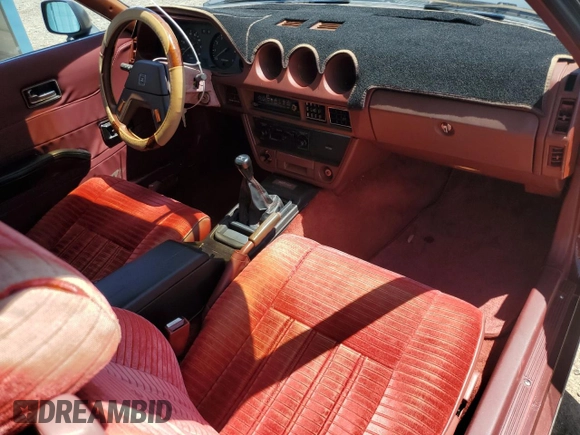 1982 Datsun 280ZX 2+2 z VIN JN1HZ06S5CX429361, wystawiony jako Copart lot #59239365 z przebiegiem 139 002 mil mil oraz Tytuł czysty. Historia ofert i sprzedaży dostępna na DreamBid. Obrazek 8.