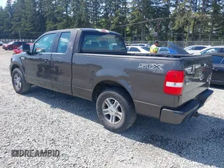 2005 Ford F-150 STX with VIN 1FTRX14W35FB18409, listed as a IAAI auction lot 42140190 with 209,198 mi miles and . Bid and sale history available at carsss.com. Image 3.