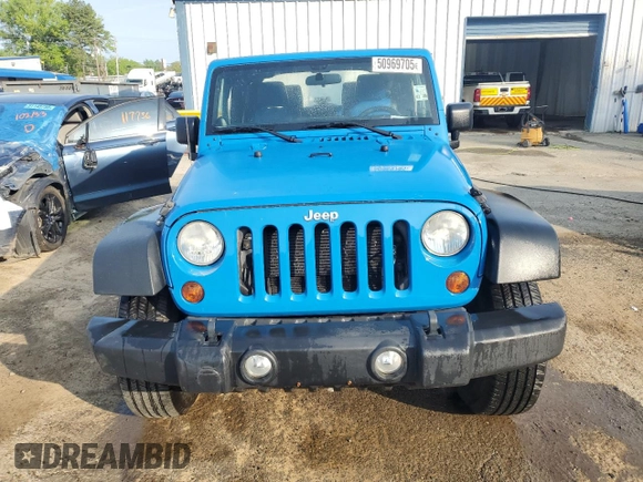 2012 Jeep Wrangler Sport with VIN 1C4AJWAG3CL144015, listed as a Copart auction lot 50969705 with 93,417 mi miles and Salvage title. Bid and sale history available at DreamBid. Image 5.