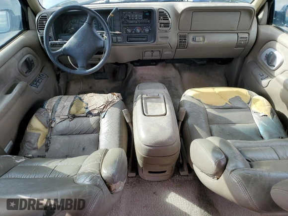 1997 GMC Suburban z VIN 3GKGK26J0VG522963, wystawiony jako Copart lot #56804105 z przebiegiem 297 544 mil mil oraz Tytuł czysty. Historia ofert i sprzedaży dostępna na DreamBid. Obrazek 8.