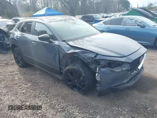 2023 Mazda CX-30 S Carbon Edition with VIN 3MVDMBCM8PM502891, listed as a IAAI auction lot 42050533 with 20,035 mi miles and . Bid and sale history available at DreamBid. Image 1.