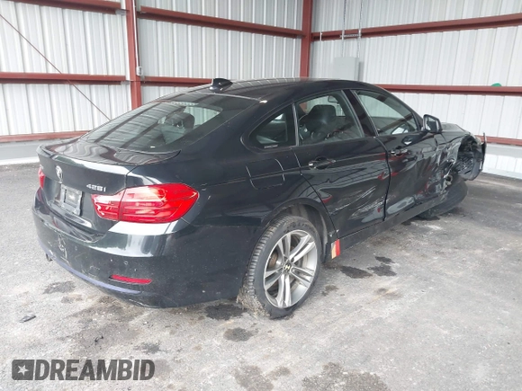 2015 BMW 4 Series 428i xDrive with VIN WBA4C9C57FD331872, listed as a IAAI auction lot 42276675 with 106,543 mi miles and . Bid and sale history available at DreamBid. Image 4.