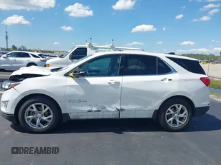 2020 Chevrolet Equinox LT z VIN 3GNAXKEV0LS650936, wystawiony jako IAAI lot #42263480 z przebiegiem 51 723 mil mil oraz . Historia ofert i sprzedaży dostępna na DreamBid. Obrazek 14.