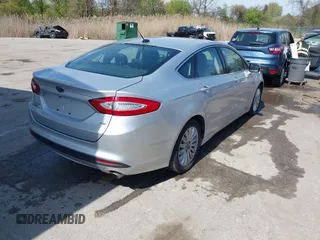 2016 Ford Fusion Energi SE Luxury with VIN 3FA6P0PU8GR273122, listed as a IAAI auction lot 42062083 with 166,318 mi miles. Bid and sale history available at carsss.com. Image 4.