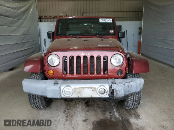 2010 Jeep Wrangler Sahara z VIN 1J4GA5D11AL106768, wystawiony jako Copart lot #56935745 z przebiegiem 143 212 mil mil oraz Szkoda całkowita • Salvage title. Historia ofert i sprzedaży dostępna na DreamBid. Obrazek 5.