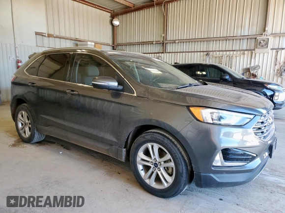 2019 Ford Edge SEL z VIN 2FMPK3J96KBC72783, wystawiony jako Copart lot #57761175 z przebiegiem 153 590 mil mil oraz Czysty tytuł • Clean title. Historia ofert i sprzedaży dostępna na DreamBid. Obrazek 4.