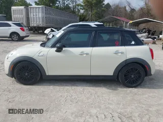 2017 MINI Hardtop 4 Door Cooper S z VIN WMWXU3C54H2D32602, wystawiony jako IAAI lot #41458333 z przebiegiem 124 235 mil mil oraz . Historia ofert i sprzedaży dostępna na DreamBid. Obrazek 14.