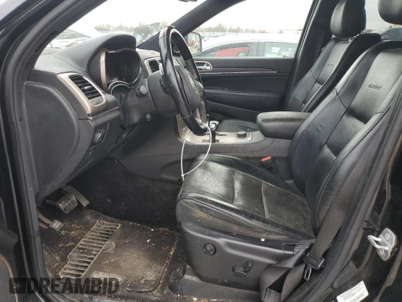 2014 Jeep Grand Cherokee Summit with VIN 1C4RJFJG1EC323658, listed as a Copart auction lot 50740115 with 253,656 mi miles and Salvage title. Bid and sale history available at DreamBid. Image 7.