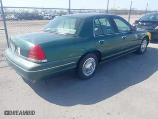 2000 Ford Crown Victoria with VIN 2FAFP73W9YX117108, listed as a IAAI auction lot 41713328 with 83,018 mi miles. Bid and sale history available at carsss.com. Image 4.