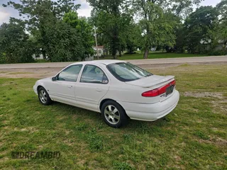 1998 Mercury Mystique z VIN 1MEFM66L2WK653881, wystawiony jako Copart lot #57662125 z przebiegiem 119 189 mil mil oraz Tytuł czysty. Historia ofert i sprzedaży dostępna na DreamBid. Obrazek 3.