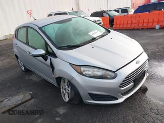 2019 Ford Fiesta SE z VIN 3FADP4EJ7KM147864, wystawiony jako IAAI lot #41692160 z przebiegiem 87 417 mil mil oraz . Historia ofert i sprzedaży dostępna na DreamBid. Obrazek 1.