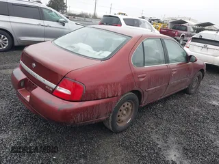 2000 Nissan Altima XE with VIN 1N4DL01D1YC189431, listed as a IAAI auction lot 41502056 with 215,958 mi miles. Bid and sale history available at carsss.com. Image 4.
