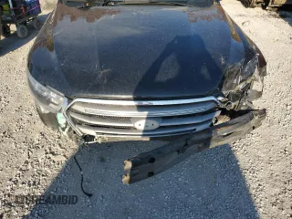 2015 Ford Taurus SEL z VIN 1FAHP2E85FG151155, wystawiony jako Copart lot #77791634 z przebiegiem 224 144 mil mil oraz Szkody całkowita. Historia ofert i sprzedaży dostępna na DreamBid. Obrazek 11.