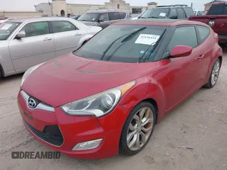 2013 Hyundai Veloster w/Gray Int with VIN KMHTC6AD2DU141462, listed as a IAAI auction lot 42136445 with 122,146 mi miles and . Bid and sale history available at DreamBid. Image 2.